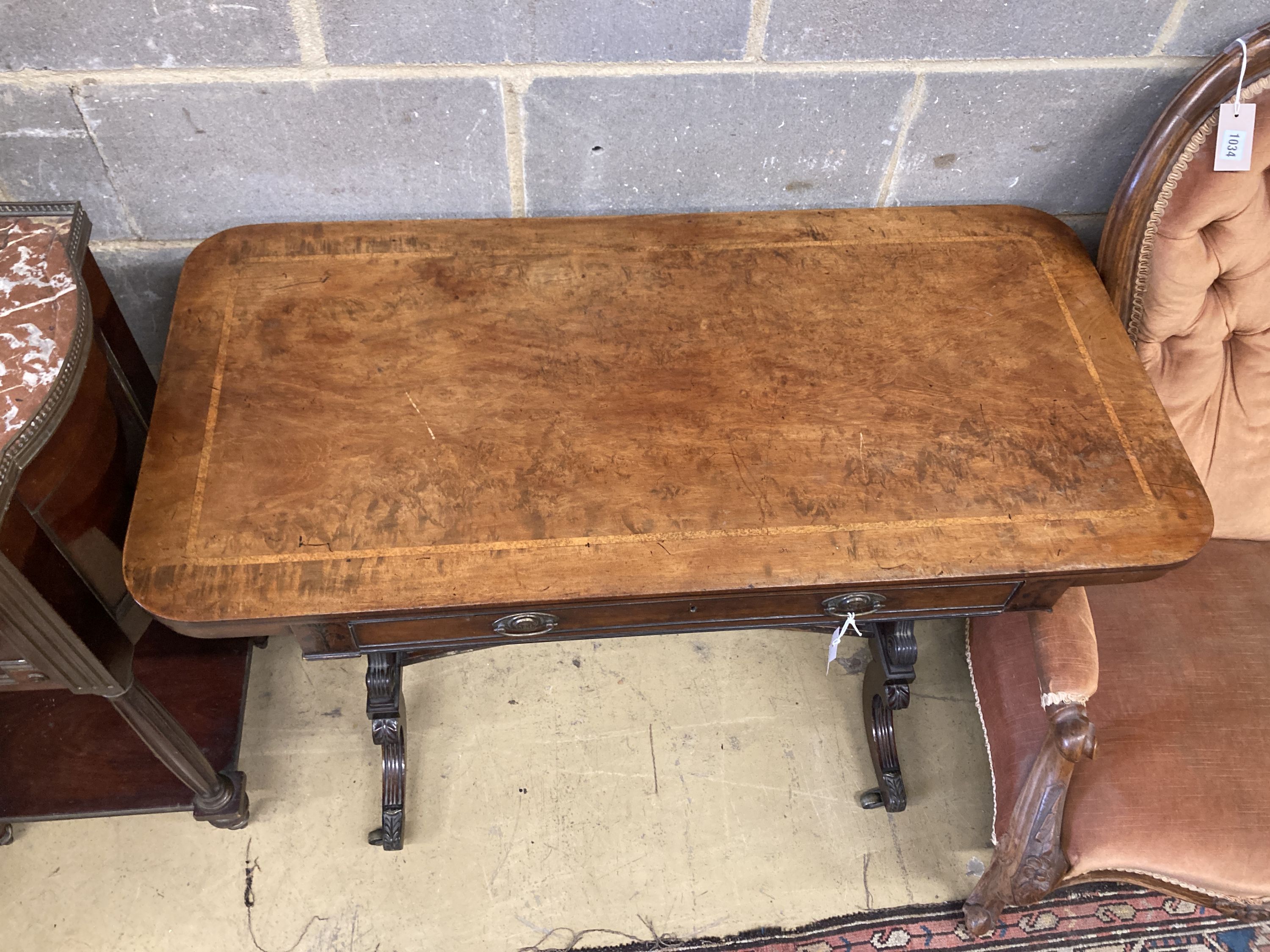 A Regency banded and ebony inlaid walnut writing table, width 106cm, depth 52cm, height 73cm